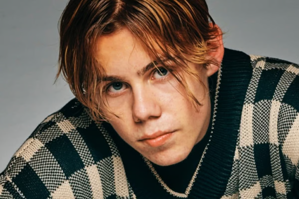 The Kid Laroi net worth 2025 performing on stage during world tour