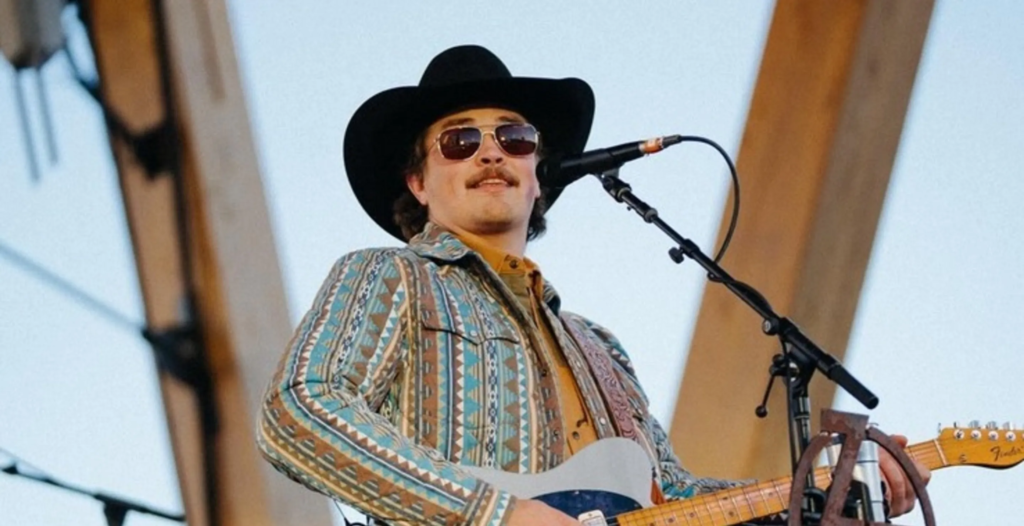 Country singer Zach Top performing a love song inspired by Zach Top wife